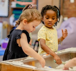 Corlears nursery students at the sand bin