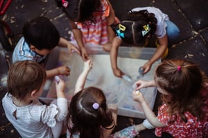 Early childhood students hard at work in the sand bin