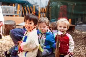 Early childhood students having fun in the backyard