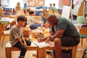 Jameel working with a first grade student