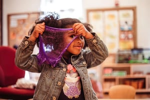 PreK student having fun with slime