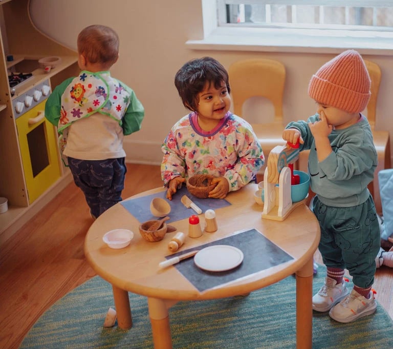 Roots students playing with magnatiles