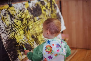 Roots toddler classroom - playing with paint - wider crop