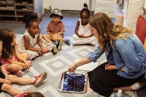 Sara teaching art to Seedlings students