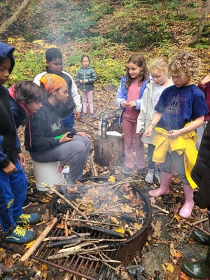 Students at camp fire at Corlears overnight-1