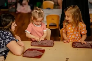 Playing with play dough in the Seedlings classroom