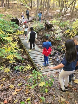 Walking over bridges at Corlears camp